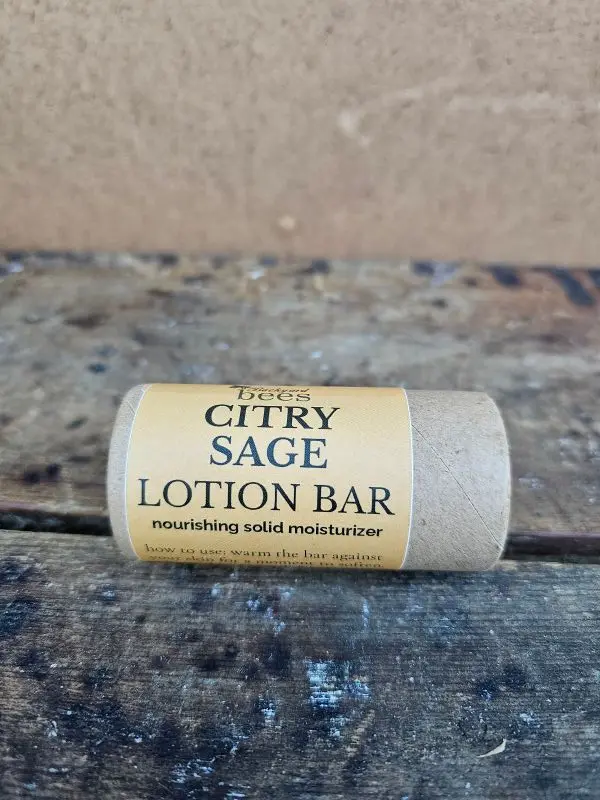 Citry Sage citrus beeswax lotion bar by Backyard Bees with a warm, natural background.