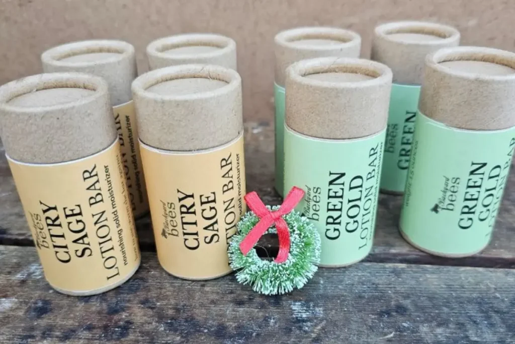 Green Gold and Citry Sage lotion bars arranged with holiday touches, symbolizing comfort and gifting.